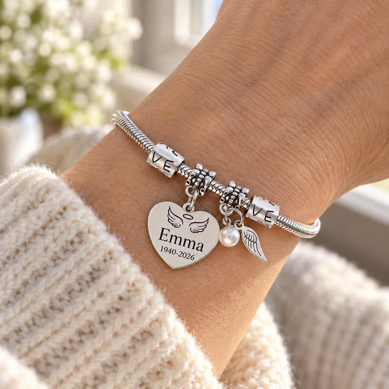 Personalized pearl wings memorial bracelet — worn on the wrist