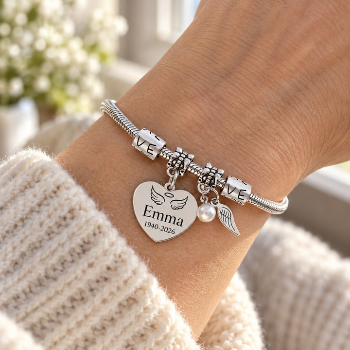 Personalized pearl wings memorial bracelet — worn on the wrist